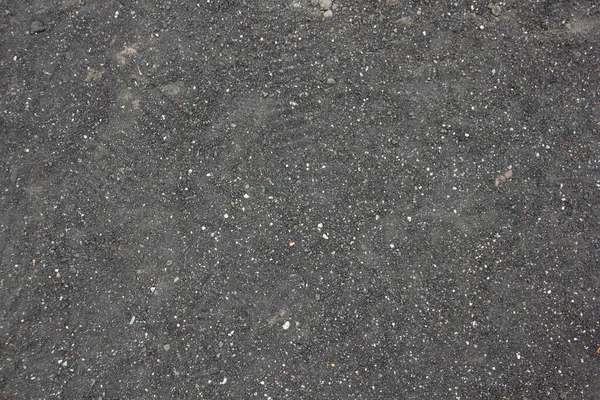 Texturerad bakgrund av små stenar och sand från berget Etna. — Stockfoto