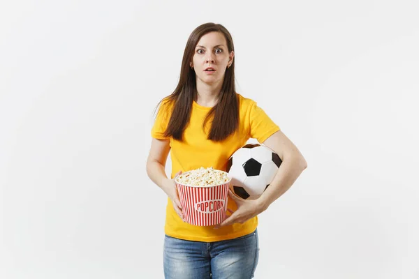 Screaming European woman, football fan holding soccer ball, bucket of popcorn upset of loss or goal of favorite team isolated on white background. Sport, play football, cheer, fans lifestyle concept