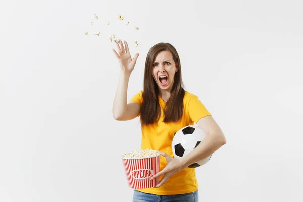 Screaming European woman, football fan holding soccer ball, bucket of popcorn upset of loss or goal of favorite team isolated on white background. Sport, play football, cheer, fans lifestyle concept