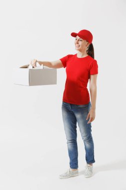 Full length of woman in red cap, t-shirt giving food order cake box isolated on white background. Female courier holding dessert in unmarked cardboard box. Delivery service concept. Receiving package clipart