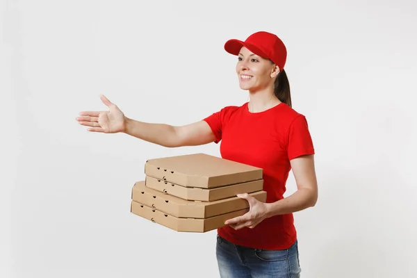 Delivery woman in red cap, t-shirt giving food order pizza boxes isolated on white background. Female courier standing with outstretched hand for greeting, holding italian pizza in cardboard flatbox