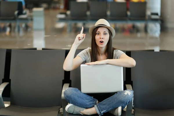 Young Traveler Tourist Woman Laptop Sitting Crossed Legs Holding Finger Stock Picture