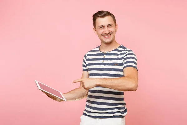 Portrait of user young man wearing striped t-shirt working on ta