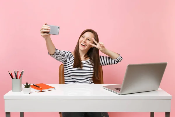 Happy Woman Doing Selfie Shot Mobile Phone Showing Victory Sign — стоковое фото