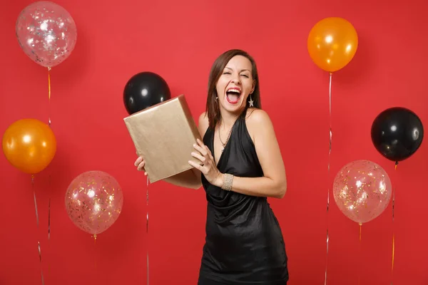 Excited Happy Girl Little Black Dress Celebrating Hold Golden Box — Stock Photo, Image