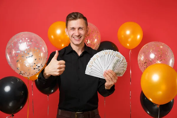 Joyful Young Man Classic Shirt Showing Thumb Holding Bundle Lots — Stock Photo, Image