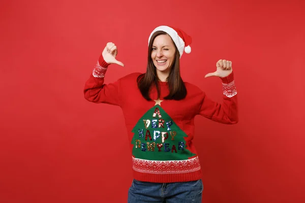 Attractive Young Santa Girl Knitted Sweater Christmas Hat Blinking Pointing — Stock Photo, Image