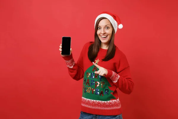Podekscytowany Młoda Dziewczyna Santa Wskazując Palcem Wskazującym Telefon Komórkowy Puste — Zdjęcie stockowe
