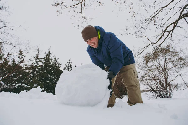 Joyful Young Man Blue Winter Warm Clothes Playing Making Snowball — Stock Photo, Image