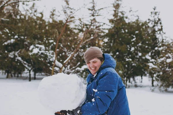 Laughing Young Man Blue Winter Warm Clothes Having Fun Holding — Stock Photo, Image