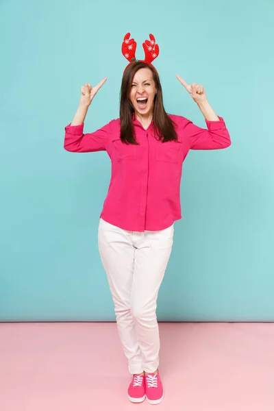 Full length portrait of fun young woman in rose shirt blouse, wh
