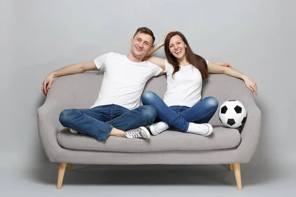 Laughing couple woman man football fans in white t-shirt cheer u