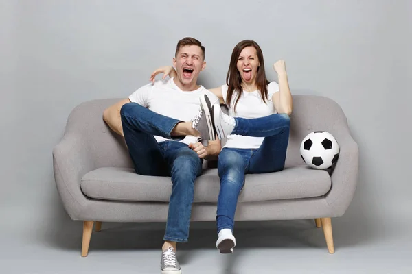 Cheerful couple woman man football fans cheer up support favorit