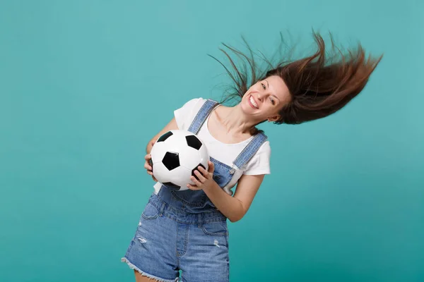 Happy young woman football fan with fluttering hair cheer up sup