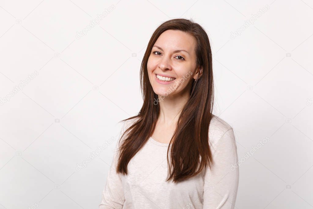 Portrait of smiling beautiful cute young woman in light clothes 