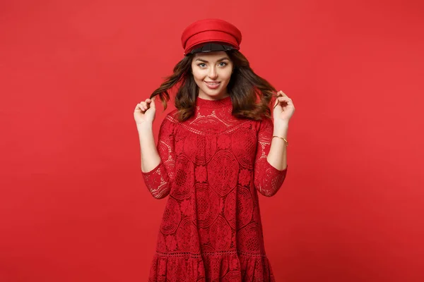 Portrait of beautiful young woman in lace dress and cap holding — Stock Photo, Image