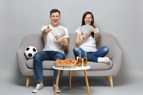 Laughing couple woman man football fans cheer up support favorit