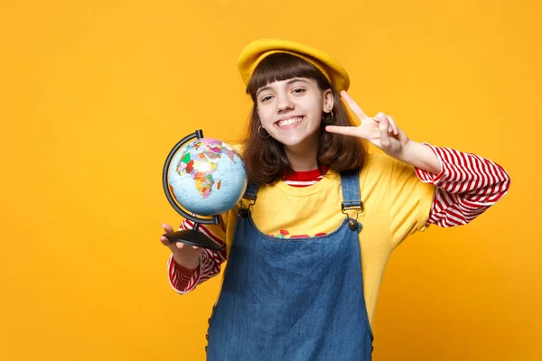 Joyful girl teenager in french beret, denim sundress showing vic — Stock Photo, Image