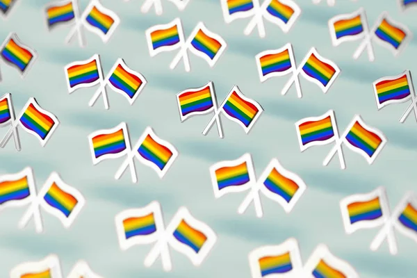 Foco DOF raso no padrão de bandeiras LGBT do arco-íris. Gay orgulho mês símbolo conceito. Isolado no fundo verde pastel. Renderização 3D — Fotografia de Stock
