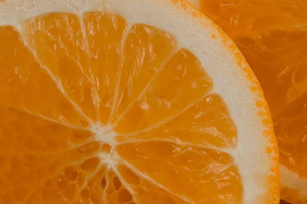 Dilim dilimlenmiş portakal, en iyi görünümü yakın çekim yuvarlak narenciye arka plan