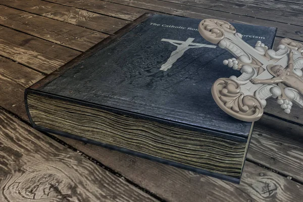 Exorcism book on wooden floor — Stock Photo, Image