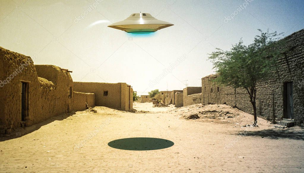 ufo flying over a desert village 