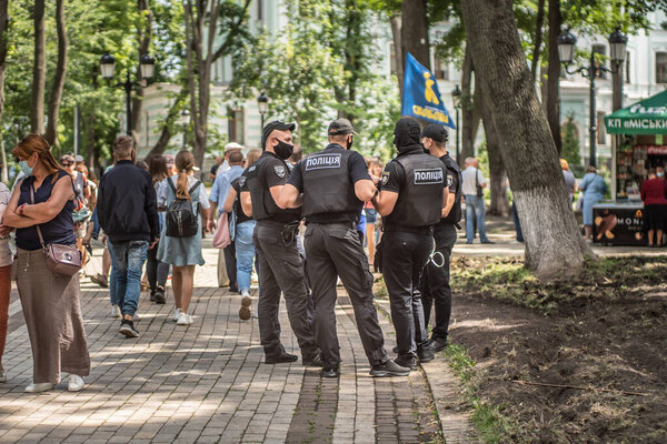 Kyiv, Ukraine - July 17, 2020: A group of Ukrainian tactical police patrols the park.