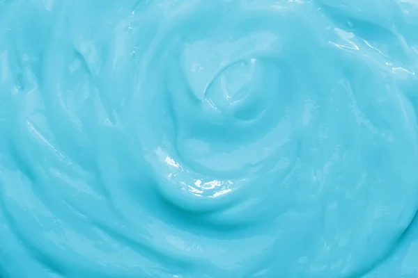 Blue cream texture. Background of cosmetic cream.