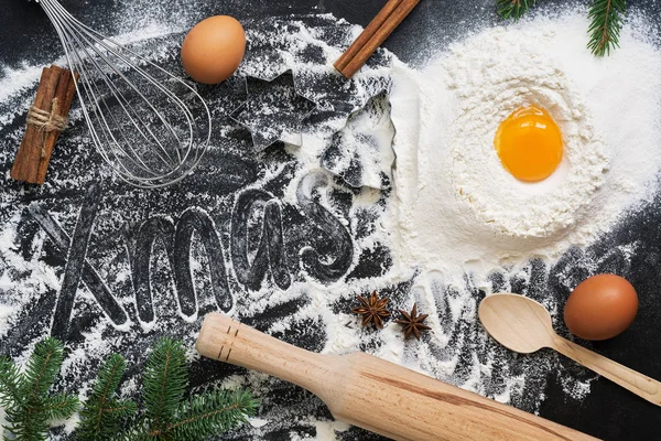 Christmas Baking background. Ingredients for cooking christmas baking on dark background. Top view ,copy space