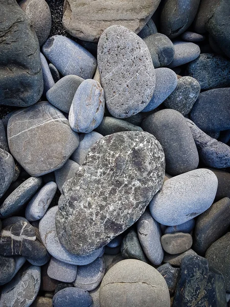 Gray pebbles close-up, Textured achtergrond, textuur van de steen — Stockfoto