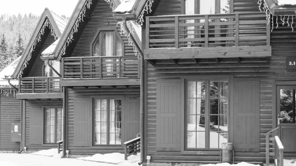 Wooden houses. Chalet at the resort. Ski resort. A number of houses. Two-storey houses for tourists. Hotel for travelers. Houses from log house. Ukrainian houses. Houses in the village.