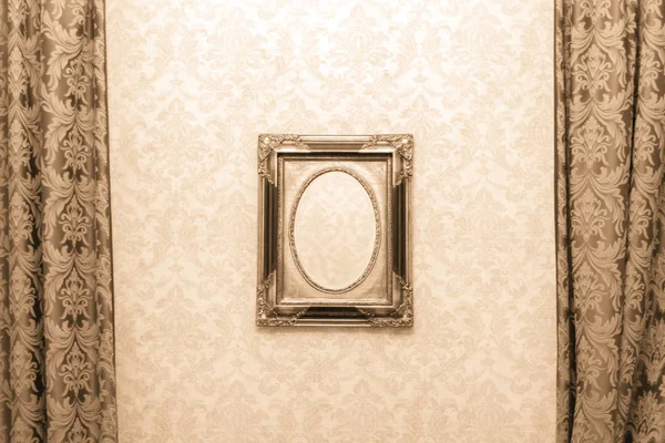 Vintage mirror without reflection. Old mirror in a carved frame. Retro style in the interior. A terrible phot from a horror movie. Empty antique frame.