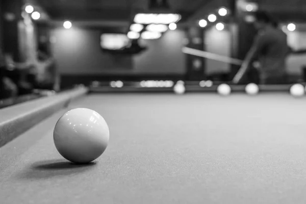 The game of American and Russian billiards. Pool table, ball and cue. Sports leisure. Friendly tournament. Winter fun. Green cloth in billiards. Luza for the ball. Aim and beat. Cue kick.