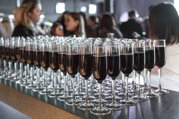 Glasses of wine and champagne. Bar counter. A lot of crystal glasses. Corporate party. Alcoholic drink. Drinks at a festive party. Banquet service.