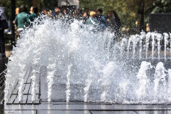 Water pressure. City fountain. Jet bottom. Spray fountain. Summer city landscape. A way to freshen up. Abnormal heat. Cool freshness of water. Several fountains.