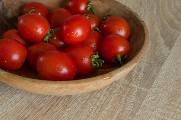 Cocktail Tomatoes. Small red tomatoes. Fresh vegetables. Healthly food. Healthy lifestyle. Tomato still life. Red products. Juicy ripe vegetables for fresh. Vegetarian food.