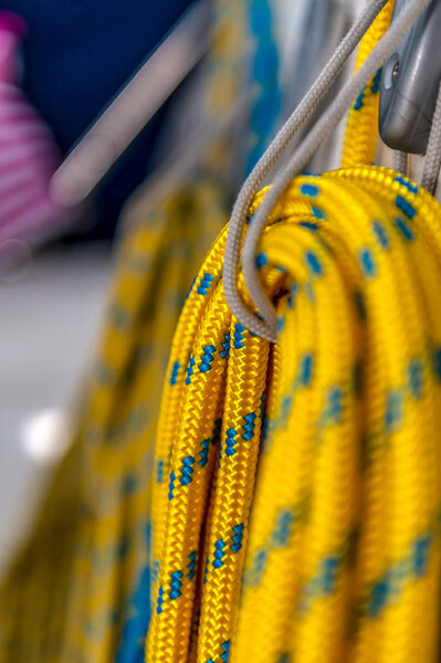 Crumbling colorful rope on the yacht. Nautical mooring rope hank on a sailboat. Close up