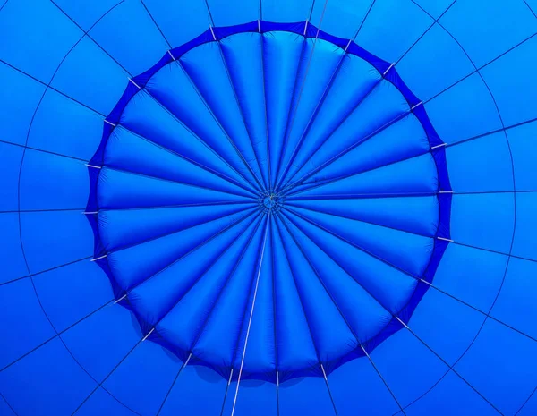 Inside a blue hot air balloon. fire from a gas burner inside a hot air balloon