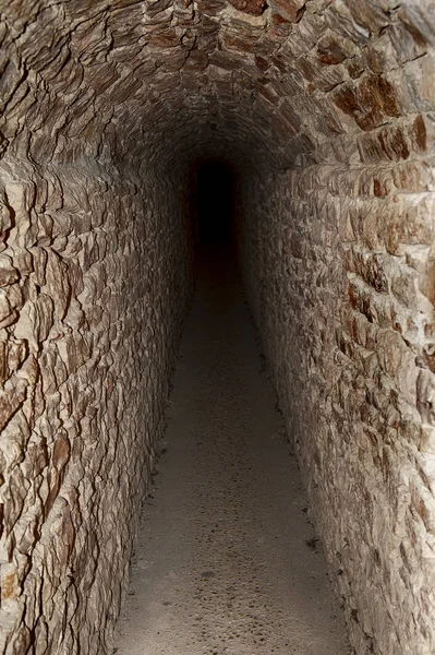 Dark tunnel under the castle walls