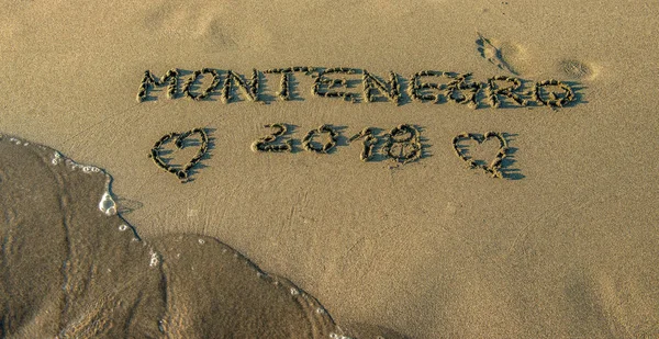 Inscription Montenegro Written Finger Wet Sand Beach Idea Album Cover — Stock Photo, Image