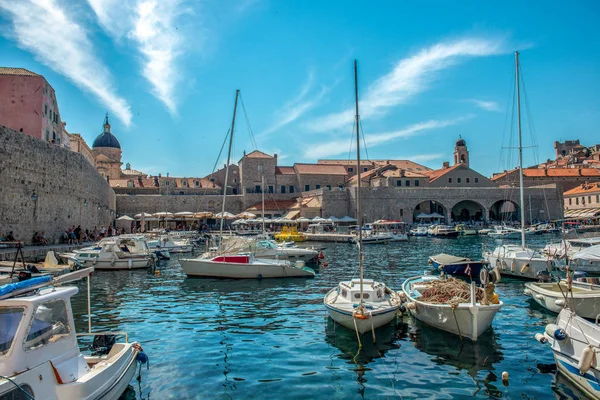 Panoramic view of Dubrovnik from the observation deck. You can see the old town, the bay with yachts and small boats and new buildings on the hill