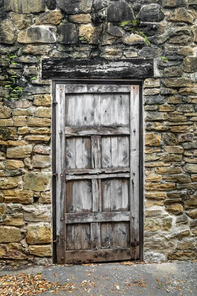 Rustic Door in Stone Wall — Stock Photo, Image