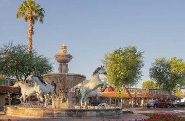 Scottsdale,Az/USA - 10.3.2018:   Bob Parks, donated this fountain in 1989,  The five champion Arabian horses complement the 5th Avenue shops and gallery old town area of Scottsdale. clipart