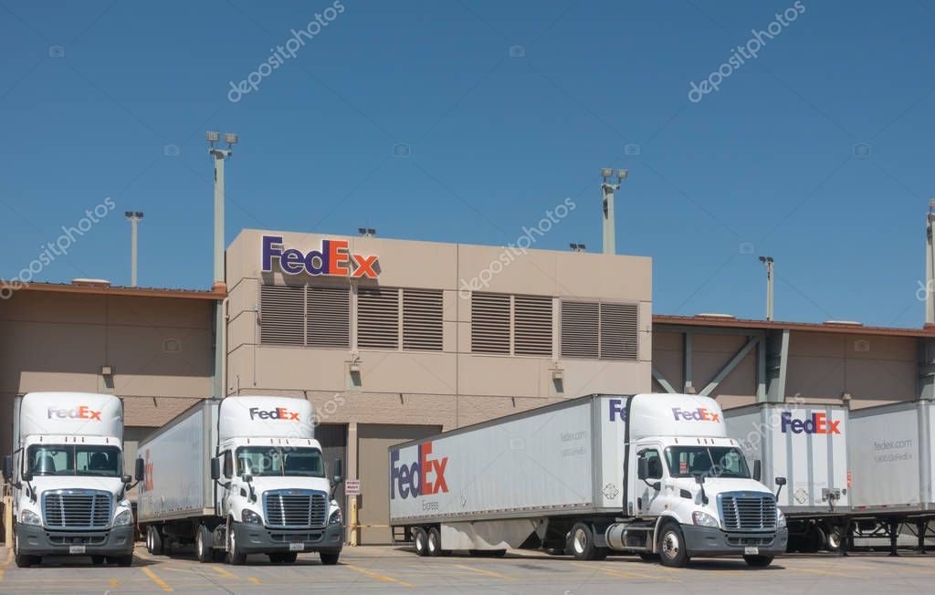 Phoenix,Az/USA - 8.16.19: Large FedEx delivery trucks at warehouse facility at SkyHarbor Airport in Phoenix.  FedEx is an American multinational courier delivery service headquater in Memphis, Tn