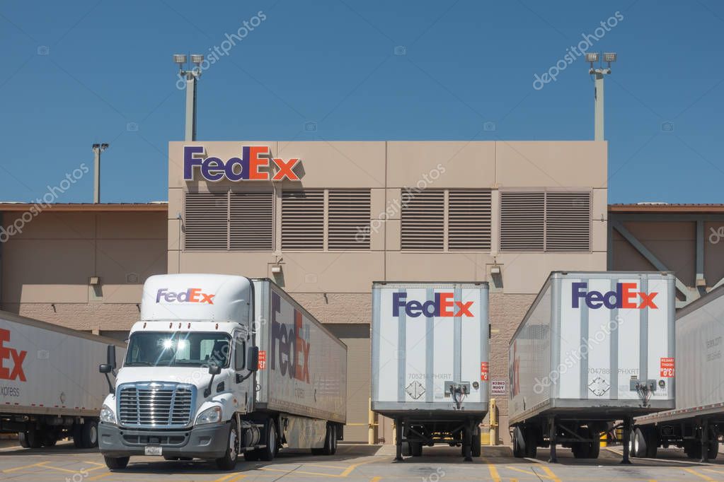 Phoenix,Az/USA - 8.16.19: Large FedEx delivery trucks at warehouse facility at SkyHarbor Airport in Phoenix.  FedEx is an American multinational courier delivery service headquater in Memphis, Tn