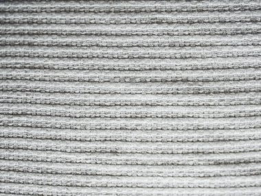 Aralarında yatay çizgiler ve kareler ile kaplı beyaz bez dokusu