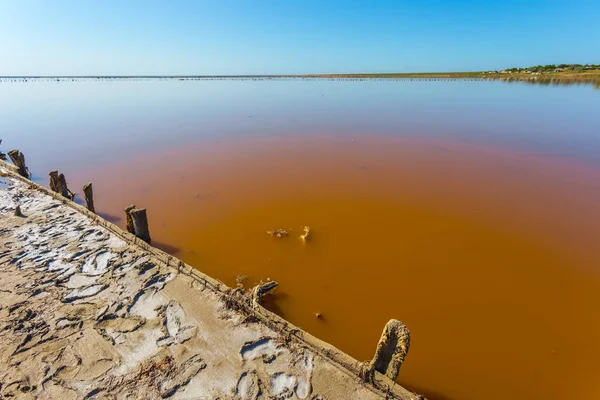 stock image red salt lake scene, old salt extraction