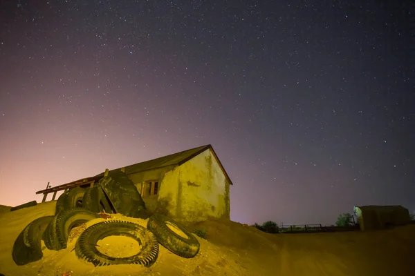 alone old house on the night starry sky background