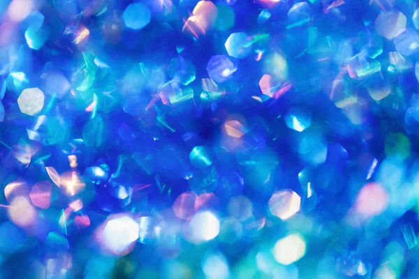 Soyut mavi ışıklar bokeh arkaplan. Şenlikli çok renkli ışıklar bulanıklaştı. Noel ve Yeni Yıl kavramı.