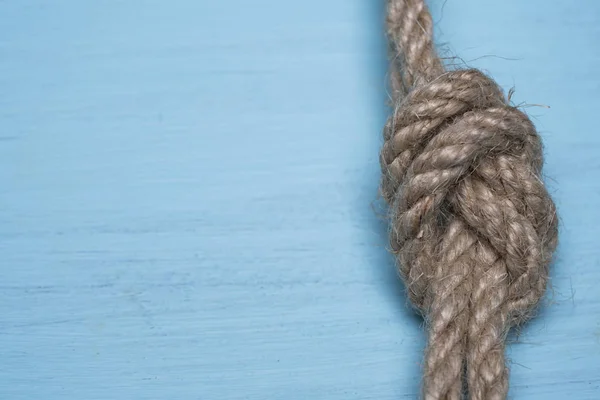 thick rope knotted on wood